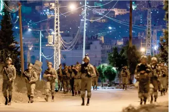  ?? AFP ?? Israeli soldiers leave after a raid at the Balata refugee camp in the occupied West Bank city of Nablus. —