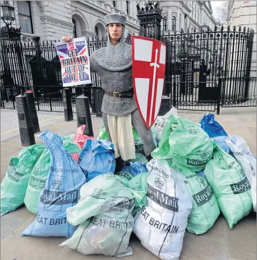  ?? Picture: JONATHAN BUCKMASTER,YUI MOK / PA ?? Your Daily Express Crusader at Downing Street with bags stuffed full of readers’ desperate appeals for Britain to get out of the EU