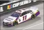  ?? Chris Graythen / Getty Images ?? Denny Hamlin was declared the winner of Wednesday’s race when it was called due to rain.