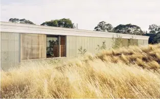  ??  ?? Sitting low among a series of landscaped berms, the home presents as an industrial shed, its cornice decorated with dots and dashes to spell out “longhouse” in Morse code.