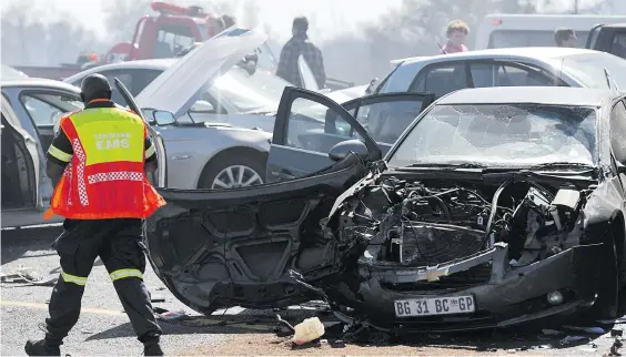  ?? Picture: Gallo Images ?? FESTIVE DISASTER. The accident scene after a collision on the N4-Rustenburg highway between Pretoria and Brits on August 7, 2013. On the same N4 highway outside Pretoria yesterday, two people died and 10 were seriously injured in a multiple vehicle crash involving four trucks, 12 cars, and a taxi.