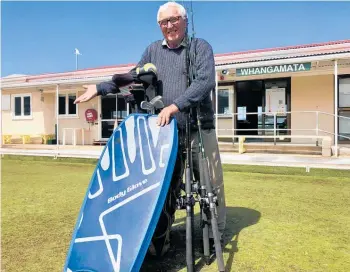  ?? Photo / Alison Smith. ?? Whangamata Bowling Club President Keith Miles with some of the bargains donated to the club for its lawn turf fundraisin­g garage sale this Saturday at Whangamata Memorial Hall.