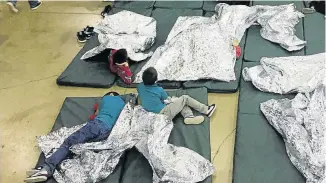  ?? Picture: HANDOUT/AFP ?? FILLING THE CAGES: This US Customs and Border Protection photo shows an intake of illegal border crossers by US Border Patrol agents at the Central Processing Centre in McAllen, Texas