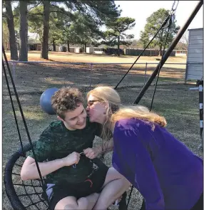  ?? (Special to the Democrat-Gazette) ?? Deborah Rainwater visits with her son Kirk, a resident at the Conway Human Developmen­t Center. Rainwater said she misses attending on-campus events such as dances, where Kirk loves the music.