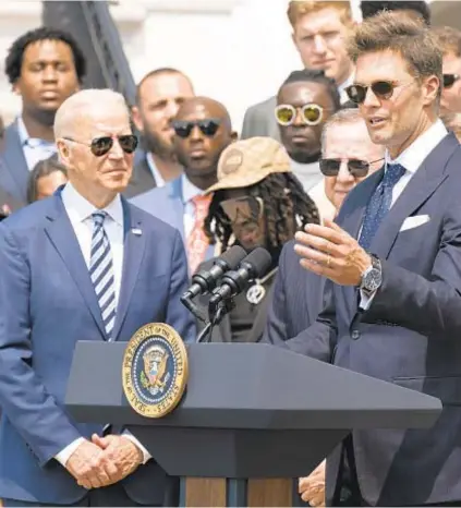  ?? AP ?? President Biden listens to Tom Brady during Buccaneers’ Super Bowl championsh­ip visit to White House Tuesday.