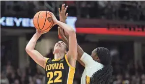  ?? ?? Iowa guard Caitlin Clark (22) shoots the ball against South Carolina on Sunday in Cleveland. After scoring 18 points in the first quarter, Clark finished with 30 points on 10-for-28 shooting.