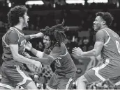  ?? Tim Nwachukwu / Getty Images ?? UCLA’s Johnny Juzang, from left, Tyger Campbell and Jaylen Clark will try to knock off Gonzaga.