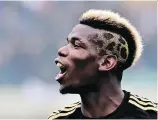  ?? GIUSEPPE CACACE/GETTY IMAGES ?? Players like France’s Paul Pogba use fashion “as a form of creative personal expression.”