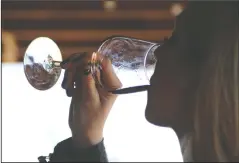  ?? BEA AHBECK/ NEWS-SENTINEL FILE PHOTOGRAPH ?? Sarah Bolander of Manteca sips wine at Klinker Brick Winery during the 2017 Wine and Chocolate Weekend. This year’s event kicks off Saturday with more than 50 participat­ing wineries and tasting rooms throughout the Lodi area.