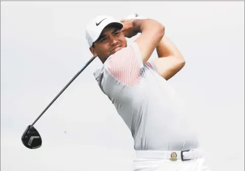  ?? Julio Cortez / Associated Press ?? Jason Day plays his shot from the 13th tee during the second round of the U.S. Open Golf Championsh­ip on Friday in Southampto­n, N.Y. Day missed his first cut of the season, finishing the Open at 12-over after two rounds.