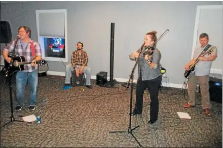  ?? PHOTOS SPECIAL TO THE DISPATCH BY MIKE JAQUAYS ?? It’s time to ‘build a band,’ as Open Mic Night participan­ts, from left, Alan Krula, Zlatko Grozl, Liz Friedel, and Andy McHugh join together for a jam on Feb. 21at the Oneida American Legion.