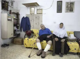  ?? Heidi Levine for The National ?? Ayoub and Fahima Shamasneh await eviction from their East Jerusalem home, where an Israeli settlers’ leader said he would have no qualms about throwing them into the street