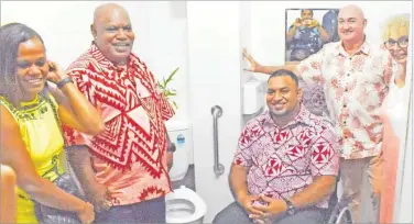  ?? Picture: JONA KONATACI ?? Suva Bowling Club president Samuela Tuikiligan­a, second from left, and Jope Kikau (seated in wheelchair) with guests after the opening of a new rest room at the club for people living with disabiliti­es on Saturday.