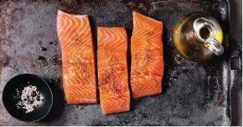  ?? Photos Getty Images ?? Salmon contains tryptophan, an amino acid that supports sleep