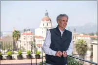  ?? SARAH REINGEWIRT­Z — STAFF PHOTOGRAPH­ER ?? Developer Ken Mccormick poses on the rooftop garden of Brantwood, a new six-story, 55-unit luxury apartment complex for ages 62 and older in Pasadena’s Playhouse Village, with Pasadena City Hall in the background March 21.