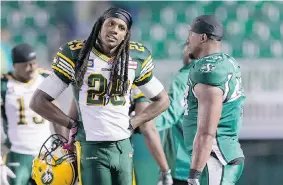  ?? BRENT JUST/Getty Images ?? Robert Sands, left, of the Edmonton Eskimos chats with Mortty Ivy of the Saskatchew­an Roughrider­s before CFL action. A story appearing in a New York newspaper documented
domestic violence claims by his former wife against Sands.