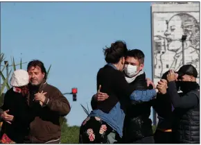  ?? (AP/Natacha Pisarenko) ?? Couples dance a tango during a protest Tuesday in Buenos Aires to call for permission to perform in open spaces. Since the pandemic hit Argentina last year, tango dancing, an essential part of Argentine culture, has been suspended as a precaution against the spread of the coronaviru­s.