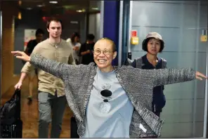  ?? AP/Lehtikuva/JUSSI NUKARI ?? Liu Xia, the widow of Chinese dissident and 2010 Nobel Peace Prize winner Liu Xiaobo, arrives Tuesday at Helsinki Internatio­nal Airport in Finland.