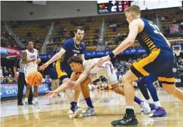  ?? AP PHOTO/KATHY KMONICEK ?? UTC seniors A.J. Caldwell, left and Jake Stephens (33) were key parts of the Mocs’ run to a runner-up finish in the SoCon Tournament under first-year head coach Dan Earl.