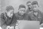  ?? PROVIDED BY MIKKI K. HARRIS ?? A group of students tries to solve an equation on a laptop during the SMASH ( Summer Math and Science Honors) program at Morehouse College in Atlanta in 2017.