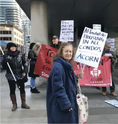  ?? SAMANTHA BEATTIE/TORONTO STAR ?? Advocacy group ACORN protests outside Housing Minister Peter Milczyn’s office Tuesday to oppose an inclusiona­ry zoning bill.
