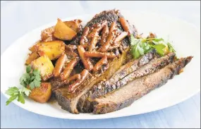  ?? Patricia Beck / Detroit Free Press / McClatchy Tribune ?? At Passover, beef brisket is a mainstay for the seder meal. You can put potatoes and carrots in it, and it’s really a one-roasting-pan meal.