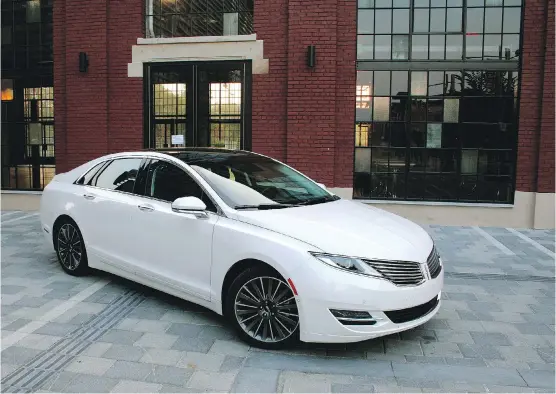  ?? JOHN LEBLANC/ DRIVING ?? The 2015 Lincoln MKZ 3.7 AWD offers an attractive exterior but could use better performanc­e and a more upscale interior.