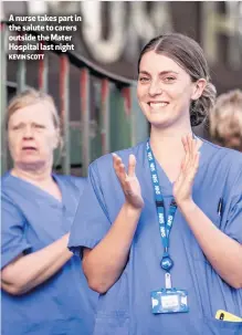  ?? KEVIN SCOTT ?? A nurse takes part in the salute to carers outside the Mater Hospital last night