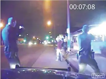  ??  ?? In this June 2, 2013, frame from a police car dash-cam video, officers aim their guns at Ricardo Diaz-Zeferino, right, and two friends while investigat­ing a bicycle theft in Gardena, Calif. Moments later, police fatally shot Diaz-Zeferino. Gardena...