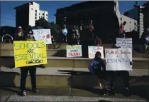  ?? ANNE WERNIKOFF — CALMATTERS ?? Families gather at Frank Ogawa Plaza in Oakland to protest the continued closure of public schools across California on Dec. 5.