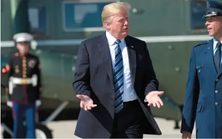  ?? AP PHOTO ?? U.S. President Donald Trump walks up the steps of Air Force One at Andrews Air Force Base, Md., on Thursday.