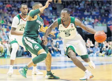  ?? AP/FILE ?? Davon Reed (5) averaged 14.9 points, 4.8 rebounds, and 2.8 assists as a senior with the Miami Hurricanes.