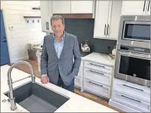  ??  ?? John Nail, homebuilde­r and developer, shows the kitchen in his model home at 2221 War Eagle Lane in Yukon. The 2,950-square-foot home is priced at $495,000. [RICHARD MIZE PHOTOS/ THE OKLAHOMAN]