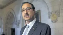  ?? THE CANADIAN PRESS FILES ?? Infrastruc­ture Minister Amarjeet Sohi speaks with the media in the Foyer of the House of Commons. Newly released documents show the Liberal government is expecting to send some $30 million in unused infrastruc­ture money directly to cities through a...