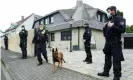  ?? Photograph: Thilo Schmülgen/Reuters ?? A sniffer dog leave a home after a police raid in Leverkusen, Germany, in June 2021.