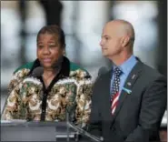  ?? MARK LENIHAN - THE ASSOCIATED PRESS ?? La-Shawn Clark, left, and Mark Cannizzaro read names of victims of the Sept. 11attacks during a ceremony marking the 17th anniversar­y on Tuesday, Sept. 11, 2018, in New York. Clark lost her husband, Benjamin Clark, and Cannizzaro lost his cousin, Brian Cannizzaro.