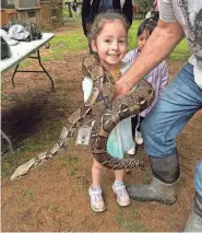  ?? PROVIDED BY VICTORIA LIMON ?? Diana Limon, Victoria Limon’s daughter, had her picture taken with a boa constricto­r at the Capital of Texas Zoo during the March 22 field trip before the bus crash that afternoon.