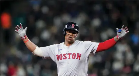  ?? LINDSEY WASSON — THE ASSOCIATED PRESS ?? Boston Red Sox third baseman Rafael Devers gestures while running the bases on a two-run home run against the Seattle Mariners during the third inning Thursday night. Devers was scratched from Friday’s lineup.