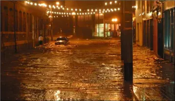  ??  ?? Common Quay Street under water in the floods of 2004.