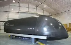  ?? Jessie Wardarski/Post-Gazette ?? The Virgin Hyperloop One "cargo" pod in 2018 at the Virgin Hyperloop One testing facility in Apex, Nev. Virgin is working with the Mid-Ohio Regional Planning Commission on a system that would connect Pittsburgh to Chicago via Columbus in about 56 minutes at a cost of about $93.