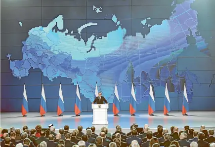  ?? AP ?? Russian President Vladimir Putin, centre, delivers a state-of-the-nation address in Moscow warning the United States against deploying new missiles in Europe.