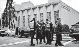  ?? MATT ROURKE/AP ?? Emergency workers gather near the Tree of Life Congregati­on in Pittsburgh on Sunday.