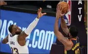  ?? ASSOCIATED PRESS FILE PHOTO ?? Golden State Warriors guard Brad Wanamaker, right, shoots as Los Angeles Lakers forward LeBron James defends during a Feb. 28 in Los Angeles.