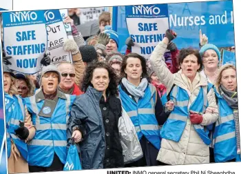  ??  ?? United: INMO general secretary Phil Ní Sheaghdha, wearing black, leading nurses on a march in Dublin city centre yesterday