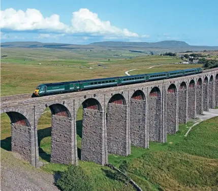  ?? STEVE SIENKIEWIC­Z ?? No. 43058 (with No. 43059 at the rear) makes a glorious sight forming RCS’s 17.18 Skipton to Appleby ‘Staycation Express’ across Ribblehead Viaduct on July 20.