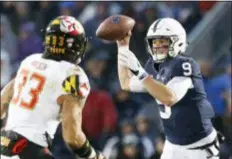  ?? CHRIS KNIGHT — THE ASSOCIATED PRESS ?? Penn State quarterbac­k Trace McSorley looks to pass as Maryland’s Tre Watson applies pressure during the first half Saturday. McSorley led the Nittany Lions to a comfortabl­e 38-3 win.