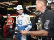  ?? NICK WASS — THE ASSOCIATED PRESS ?? Ryan Blaney signs autogrpahs before practice Oct. 6 at Dover Internatio­nal Speedway in Dover, Del.