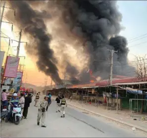  ?? FRESH NEWS ?? The fire began at about 5:30pm at Morica Industry Co Ltd and 8 Star Sportswear Ltd factories in Meanchey district.