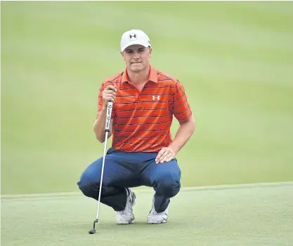  ??  ?? Jordan Spieth lines up a putt during the third round yesterday.