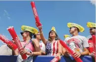  ??  ?? People cheer ahead of the Nathan’s Famous Fourth of July Hot DogEating Contest, held on Independen­ce Day, at Maimonides Park in Brooklyn, New York City.